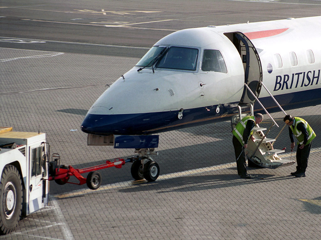G-EMBT BA Citiexpress being attended to by eningeers at GLA Stand 18 (15 May 2003 - 0735)