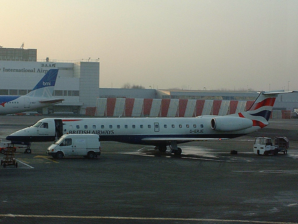 17 February 2003 (0836) BA Citiexpress G-ERJE on stnad 23 at GLA receiving attention from Engineers