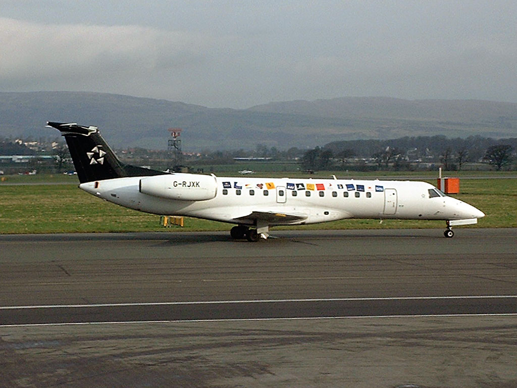 27 March 2002 (0811) bmi British Midland G-RJXK taxiing from runway 23 to Stand 16 following an early morning arrival at Glasgow