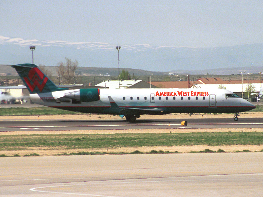 2 May 2002 (1121) N77302 America West CRJ600 taxiing in from Runway 28R @ BOI