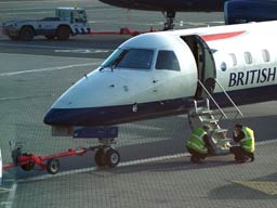 15 May 2003 (0735) G-EMBT BA Citiexpress being attended to by eningeers at GLA Stand 18