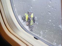 3 April 2001 - A rain soaked ground handler attending to G-LGTE @ GLA