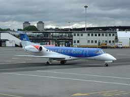 24 July 2002 (0815) G-RJXJ bmi ERJ135ER taxiing onto Stand 16 at GLA after an early morning arrival