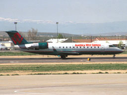 2 May 2002 (1121) N77302 America West CL600/CRJ-200LR taxiing in from Runway 28R @ BOI